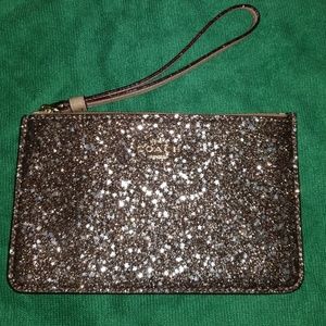 Coach star glitter sparkle wristlet gold